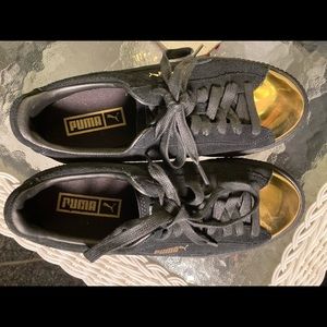 Puma Size 9 black and gold suede sneakers
